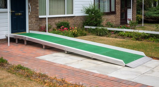 An access ramp installed at the door to a home so that a person can access it using a mobility device